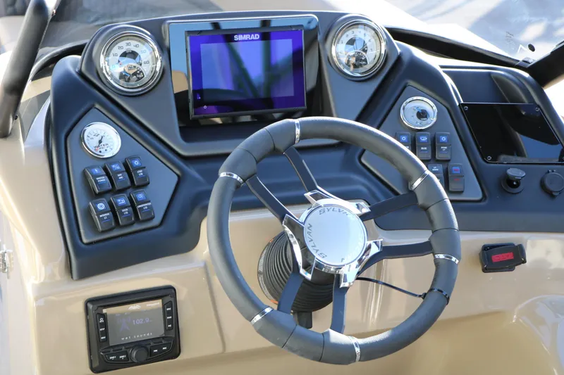 Slide: The Image of 2026 Sylvan L3 DLZ boat dashboard with steering wheel and control panel. - 22