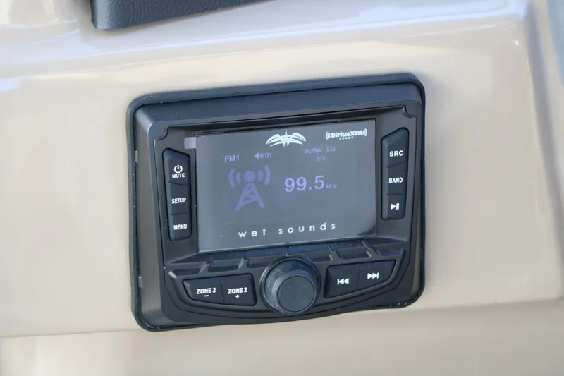 Slide: The Image of 2026 Sylvan L3 DLZ boat stereo system displaying FM radio station 99.5 MHz. - 27