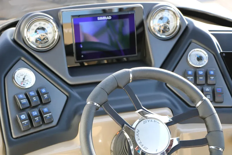Slide: The Image of Steering console of 2026 Sylvan L3 DLZ boat with modern controls and display. - 28