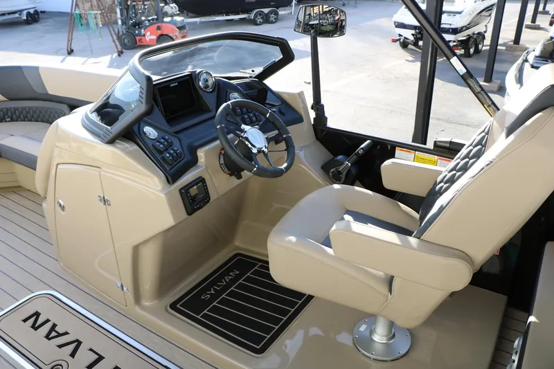 Slide: The Image of 2026 Sylvan L3 DLZ boat interior with modern steering console and comfortable seating. - 29