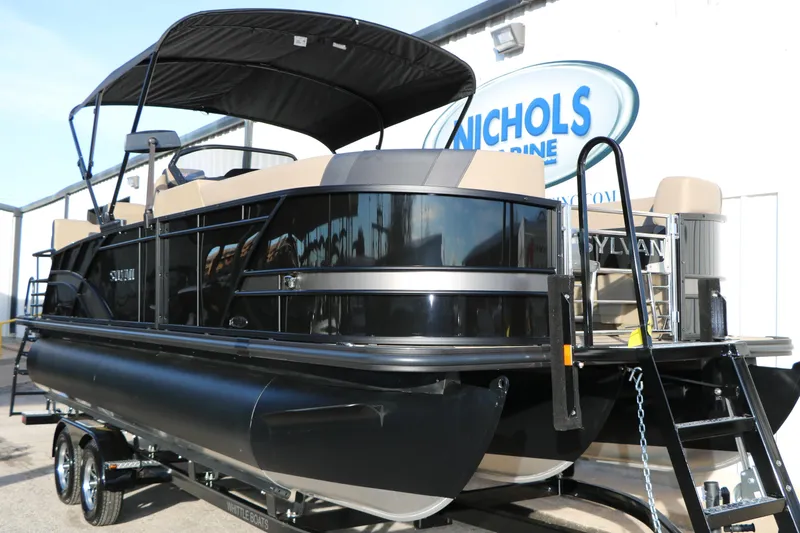 Slide: The Image of 2026 Sylvan L3 DLZ pontoon boat with canopy at Nichols Marine dealership. - 3