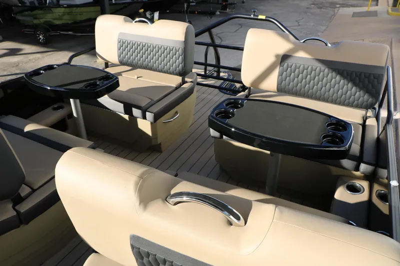 Slide: The Image of Luxurious seating area on 2026 Sylvan L3 DLZ pontoon boat with cupholders and tables. - 31
