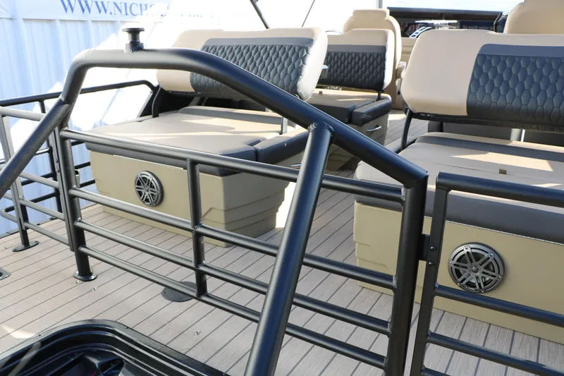 Slide: The Image of 2026 Sylvan L3 DLZ boat interior with cushioned seating and sleek railing design. - 33