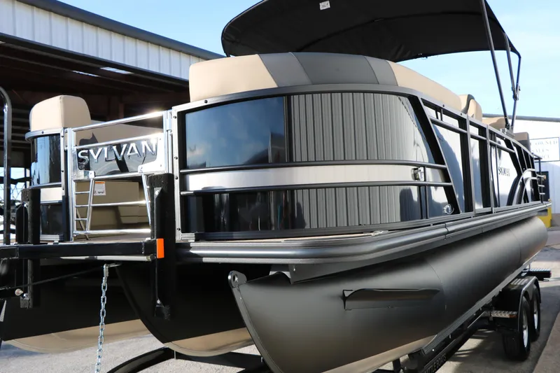 Slide: The Image of 2026 Sylvan L3 DLZ pontoon boat with sleek design and modern features. - 4