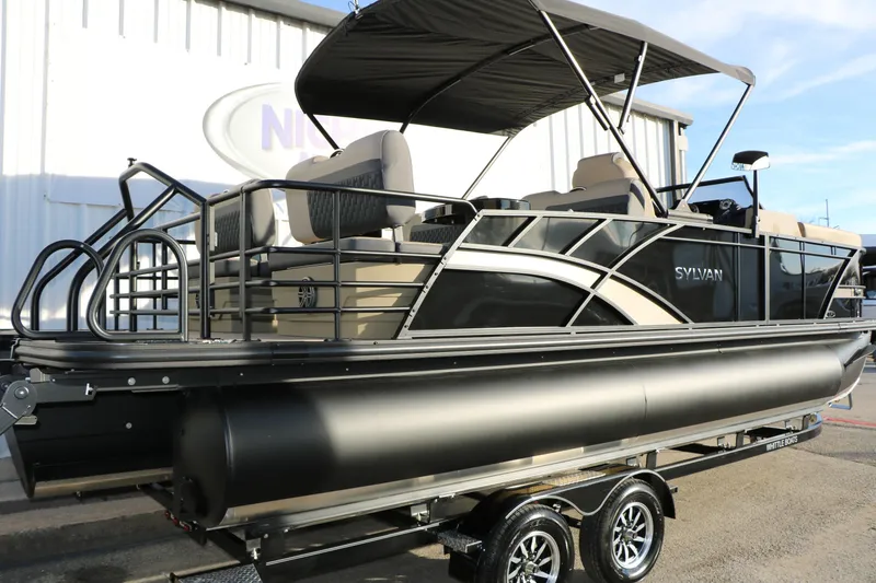 Slide: The Image of 2026 Sylvan L3 DLZ pontoon boat with canopy on trailer, side view. - 5