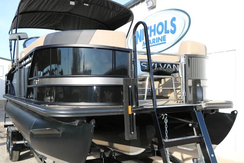 Slide: The Image of 2026 Sylvan L3 DLZ pontoon boat at Nichols Marine dealership. - 7