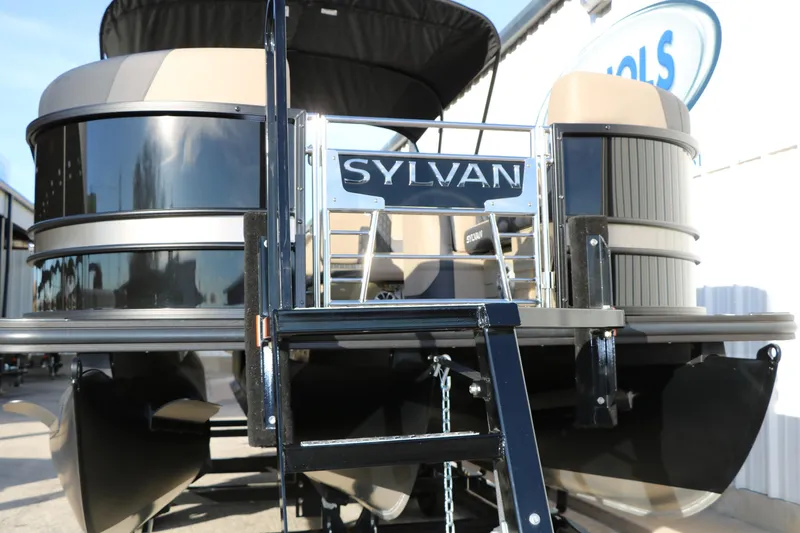 Slide: The Image of 2026 Sylvan L3 DLZ pontoon boat, front view with ladder and branding. - 8