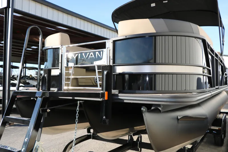 Slide: The Image of 2026 Sylvan L3 DLZ pontoon boat with sleek design and modern features. - 9