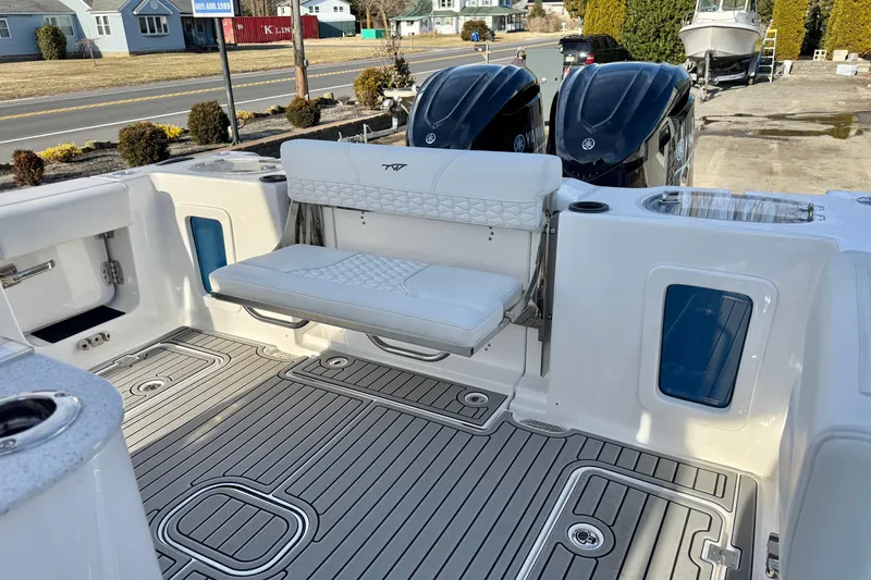 Slide: The Image of Tidewater 302 CC Adventure 2026 boat interior with seating and dual Yamaha engines. - 18