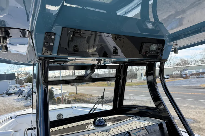 Slide: The Image of 2026 Tidewater 302 CC Adventure boat console with modern controls and navigation equipment. - 25