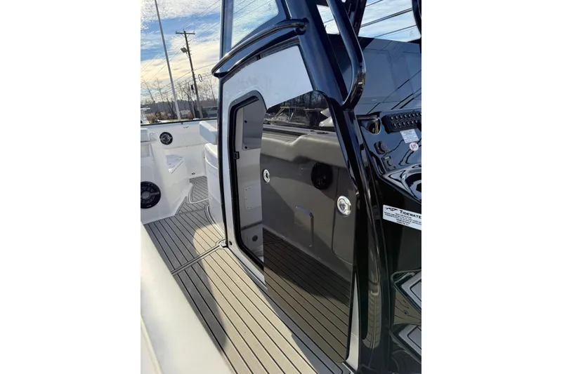 Slide: The Image of 2026 Tidewater 302 CC Adventure boat interior with sleek design and modern features. - 26