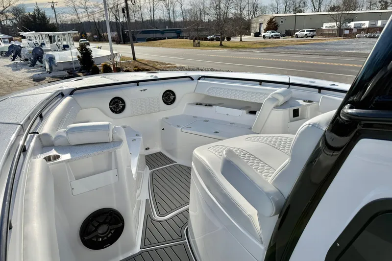 Slide: The Image of 2026 Tidewater 302 CC Adventure boat interior with white seating and modern design. - 27