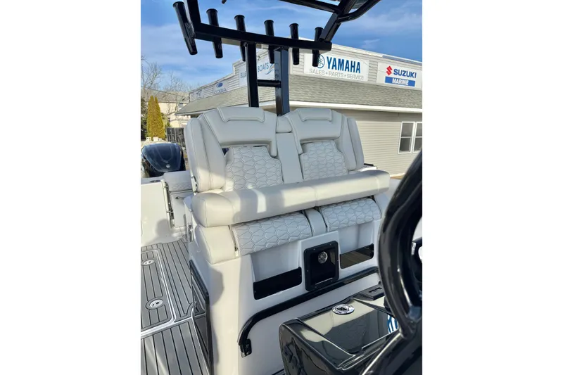 Slide: The Image of 2026 Tidewater 302 CC Adventure boat with luxurious seating and rod holders. - 34