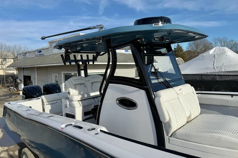 Slide: The Image of 2026 Tidewater 302 CC Adventure boat with dual engines and luxurious seating. - 40