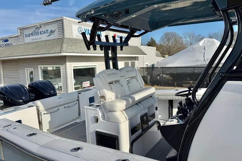 Slide: The Image of 2026 Tidewater 302 CC Adventure boat at Blue Water Boats dealership. - 41