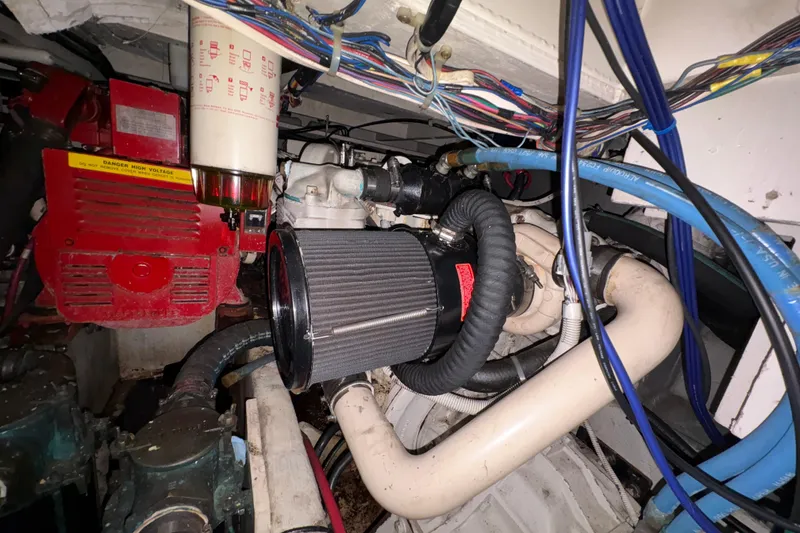 Slide: The Image of Engine room of 1988 Bayliner 3587 Motoryacht with visible components and wiring. - 101