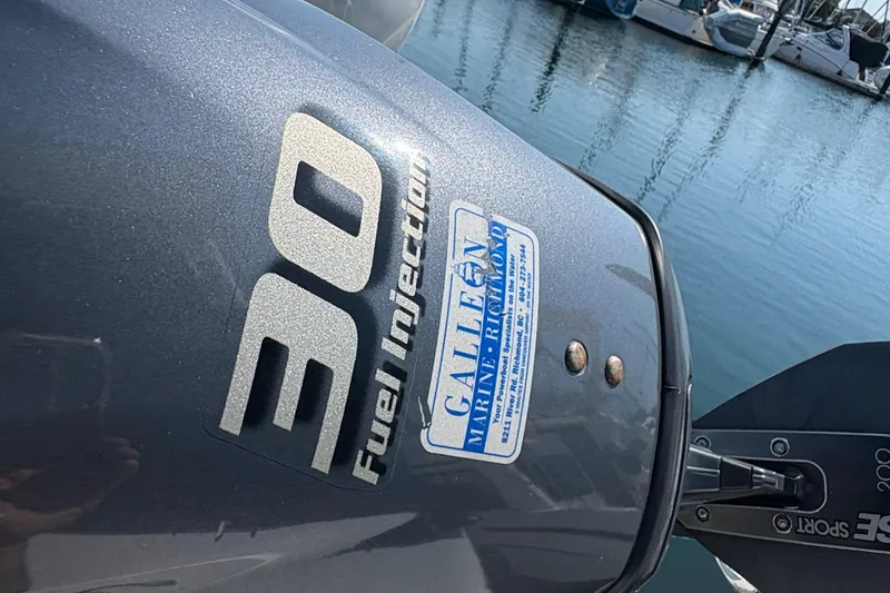 Slide: The Image of Outboard motor with "30 Fuel Injection" label on a Bayliner 3587 Motoryacht, 1988. - 14