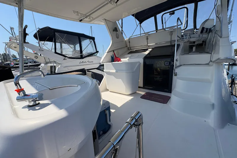 Slide: The Image of 1988 Bayliner 3587 Motoryacht deck with seating and helm, docked at marina. - 20