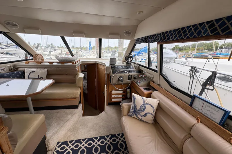 Slide: The Image of Interior of 1988 Bayliner 3587 Motoryacht with plush seating and helm station. - 46