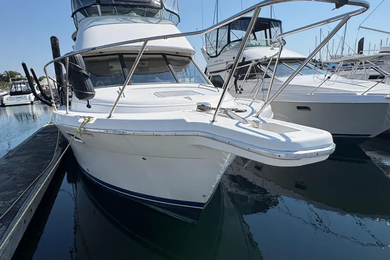 Slide: The Image of 1988 Bayliner 3587 Motoryacht docked at marina, front view. - 5
