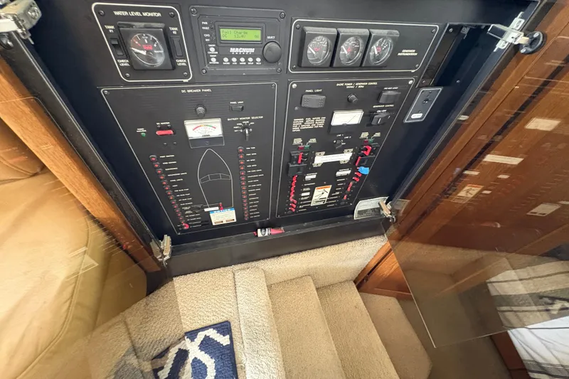 Slide: The Image of Control panel of 1988 Bayliner 3587 Motoryacht, featuring gauges and switches. - 64