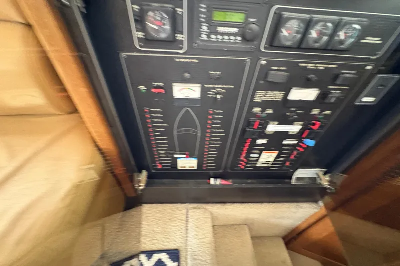 Slide: The Image of Control panel of a 1988 Bayliner 3587 Motoryacht, featuring gauges and switches. - 68