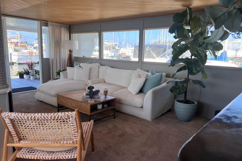 Slide: The Image of Luxurious 1977 Huckins Motor Yacht interior with cozy seating and nautical decor. - 11