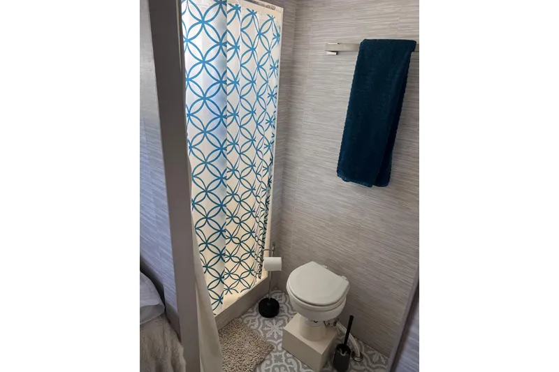 Slide: The Image of Bathroom interior of a 1977 Huckins Motor Yacht with shower and toilet. - 50