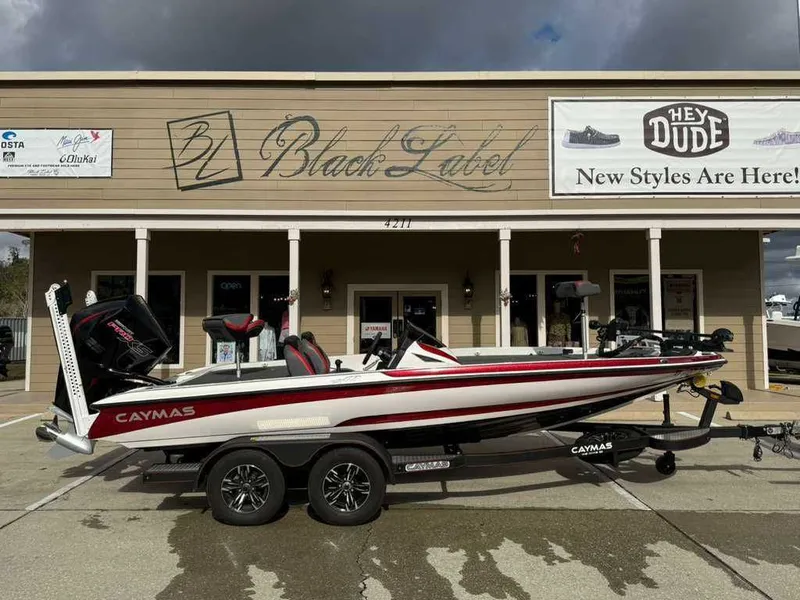 The Image of 2022 Caymas CX 19 boat parked in front of a store. - 0