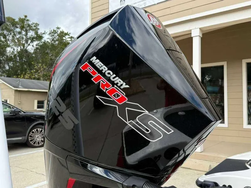 Slide: The Image of Mercury Pro XS outboard motor on a 2022 Caymas CX 19 boat. - 17