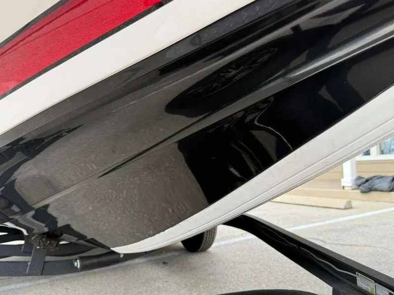 Slide: The Image of Close-up of a 2022 Caymas CX 19 boat hull. - 19