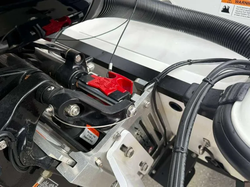 Slide: The Image of Close-up of the engine area of a 2022 Caymas CX 19 boat. - 2