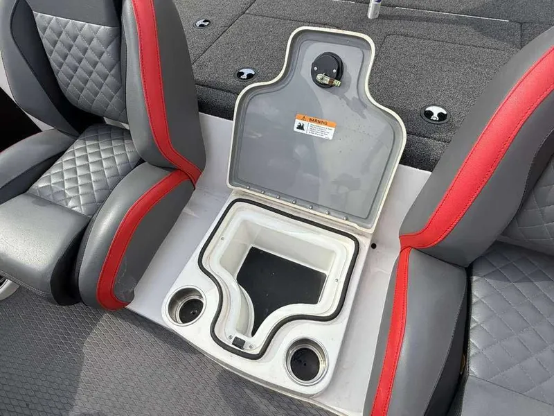 Slide: The Image of Interior of a 2022 Caymas CX 19 boat with seating and storage. - 24