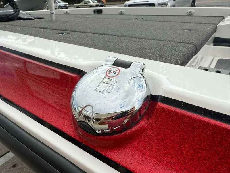 Slide: The Image of Caymas CX 19 2022 boat with red sparkle and chrome details. - 7