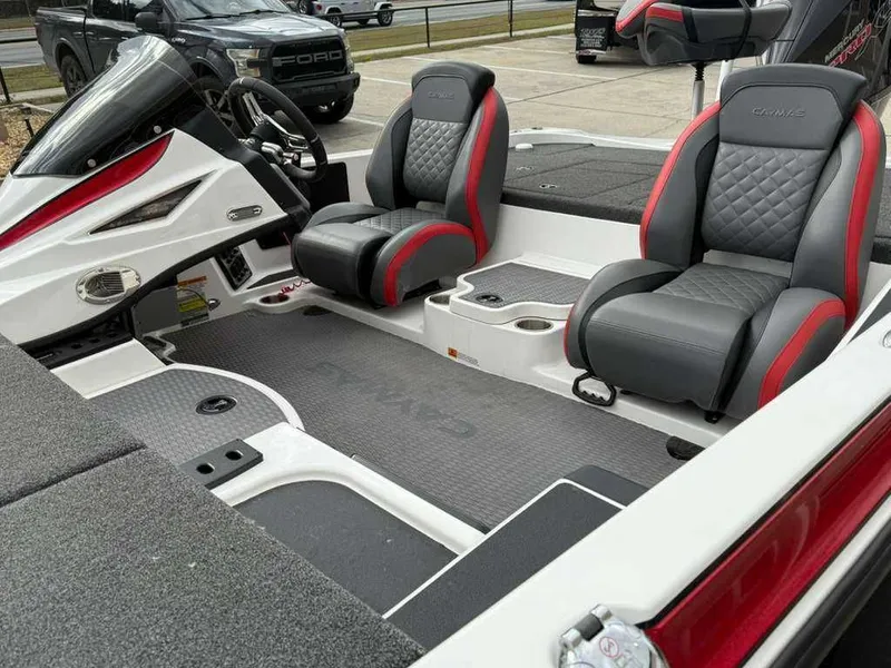 Slide: The Image of Interior of a 2022 Caymas CX 19 boat with gray and red seats. - 8