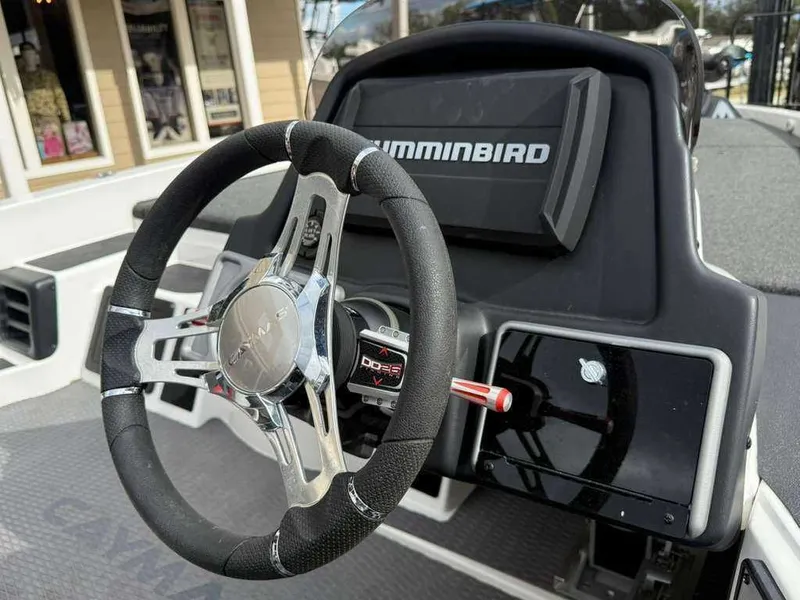 Slide: The Image of 2022 Caymas CX 19 boat dashboard with steering wheel. - 9