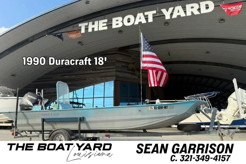 The Image of 1990 Duracraft 1860 DC boat at The Boat Yard, Louisiana, with American flag. - 0