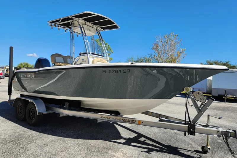 The Image of 2020 Key West 203 FS boat on trailer under clear blue sky. - 0