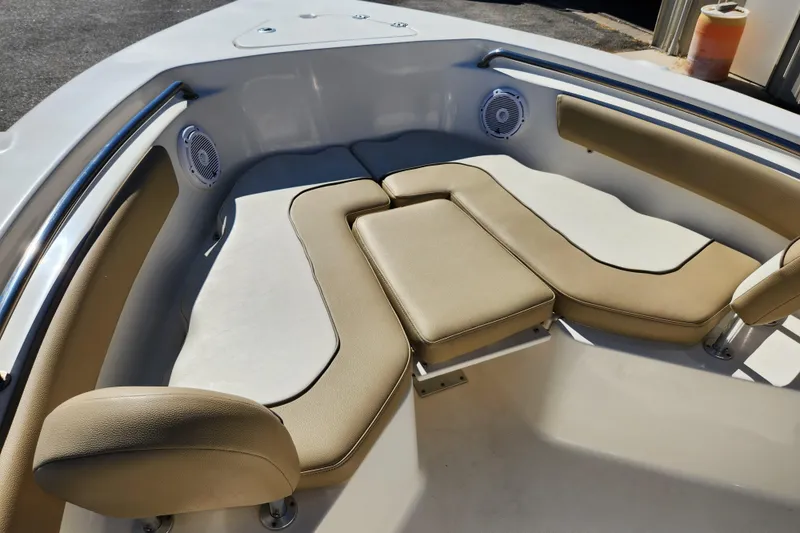 Slide: The Image of 2020 Key West 203 FS boat interior with cushioned seating and built-in speakers. - 10