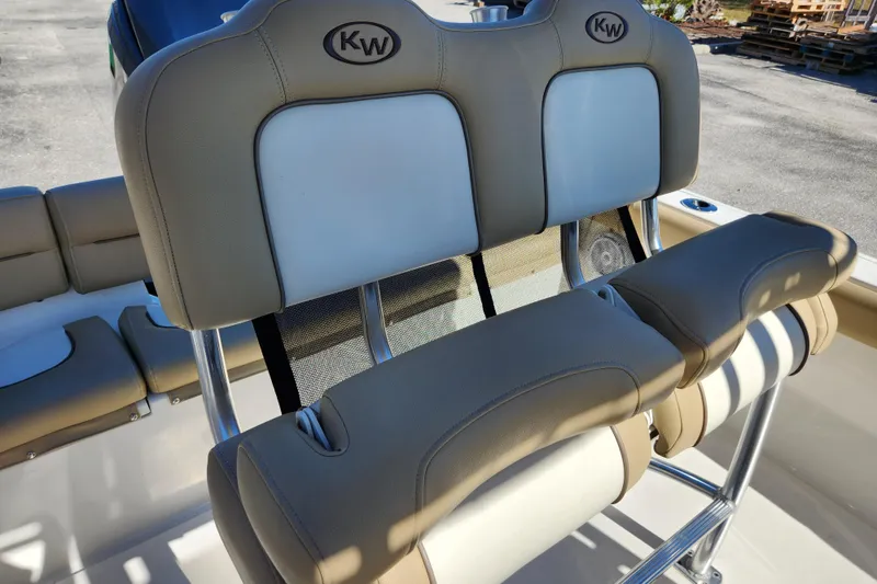 Slide: The Image of 2020 Key West 203 FS boat seating with beige and white upholstery. - 13