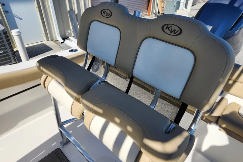Slide: The Image of 2020 Key West 203 FS boat seating with beige and white upholstery. - 14