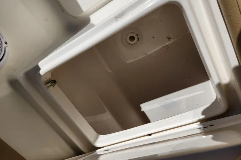 Slide: The Image of Open storage compartment in a 2020 Key West 203 FS boat. - 18