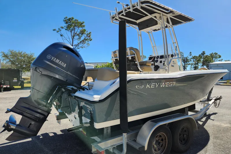 Slide: The Image of 2020 Key West 203 FS boat with Yamaha engine on trailer, parked outdoors. - 3
