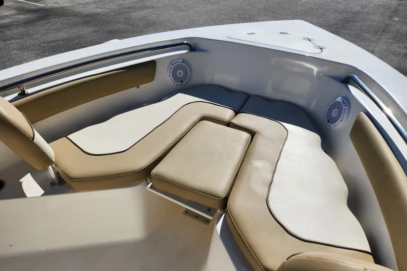 Slide: The Image of 2020 Key West 203 FS boat interior with beige cushioned seating. - 9