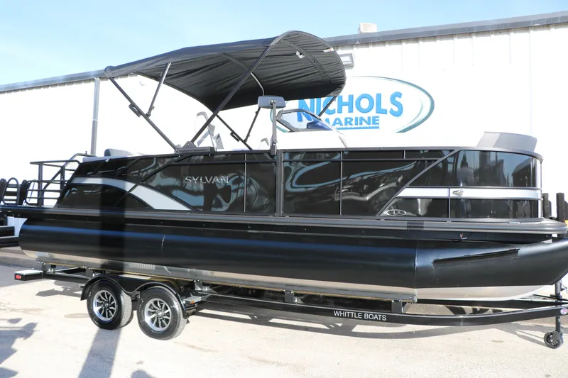 The Image of 2026 Sylvan L3 DLZ pontoon boat with canopy on trailer at Nichols Marine. - 1