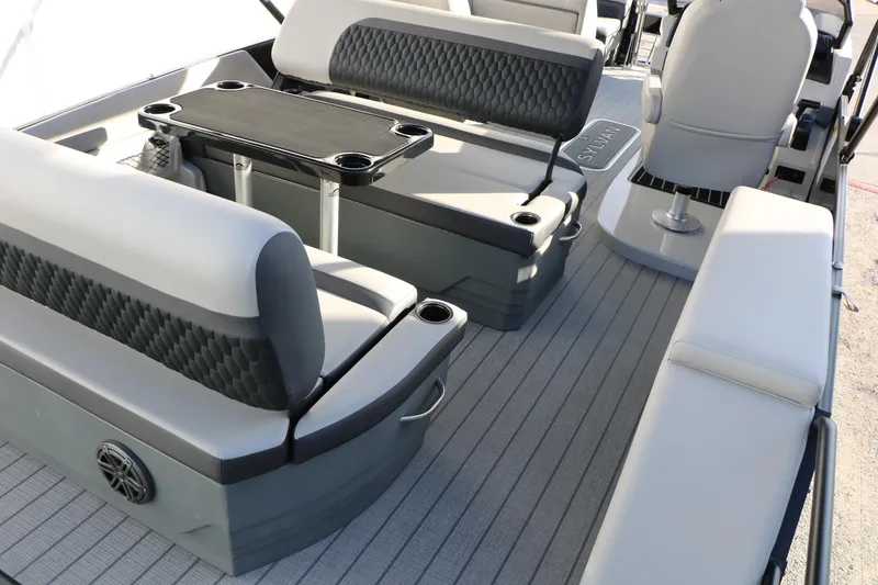 Slide: The Image of 2026 Sylvan L3 DLZ boat interior with luxurious seating and table setup. - 12