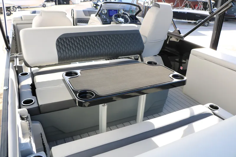 Slide: The Image of Interior of 2026 Sylvan L3 DLZ pontoon boat with seating and table. - 14