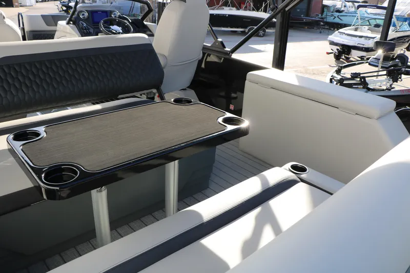 Slide: The Image of Interior of 2026 Sylvan L3 DLZ boat with seating and table setup. - 15