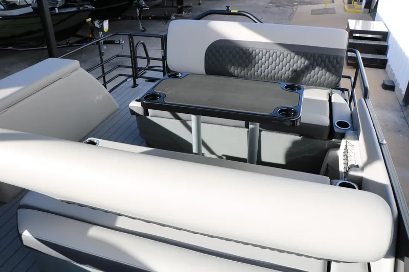 Slide: The Image of 2026 Sylvan L3 DLZ pontoon boat interior with seating and table. - 16