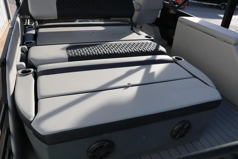 Slide: The Image of 2026 Sylvan L3 DLZ boat interior with cushioned seating and cup holders. - 18